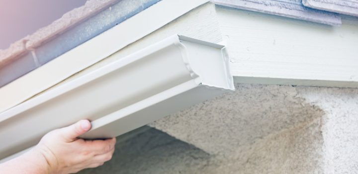 the gutter guy inspecting the gutter that is newly replaced