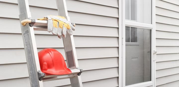 a steel ladder, along with work gloves and a hard hat