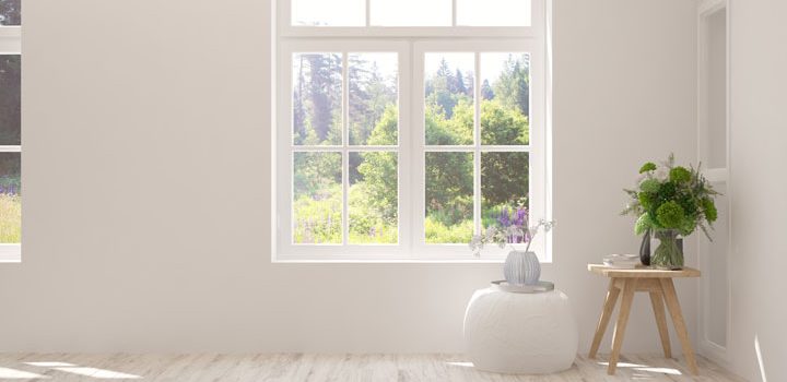 a contemporary white house with glass windows